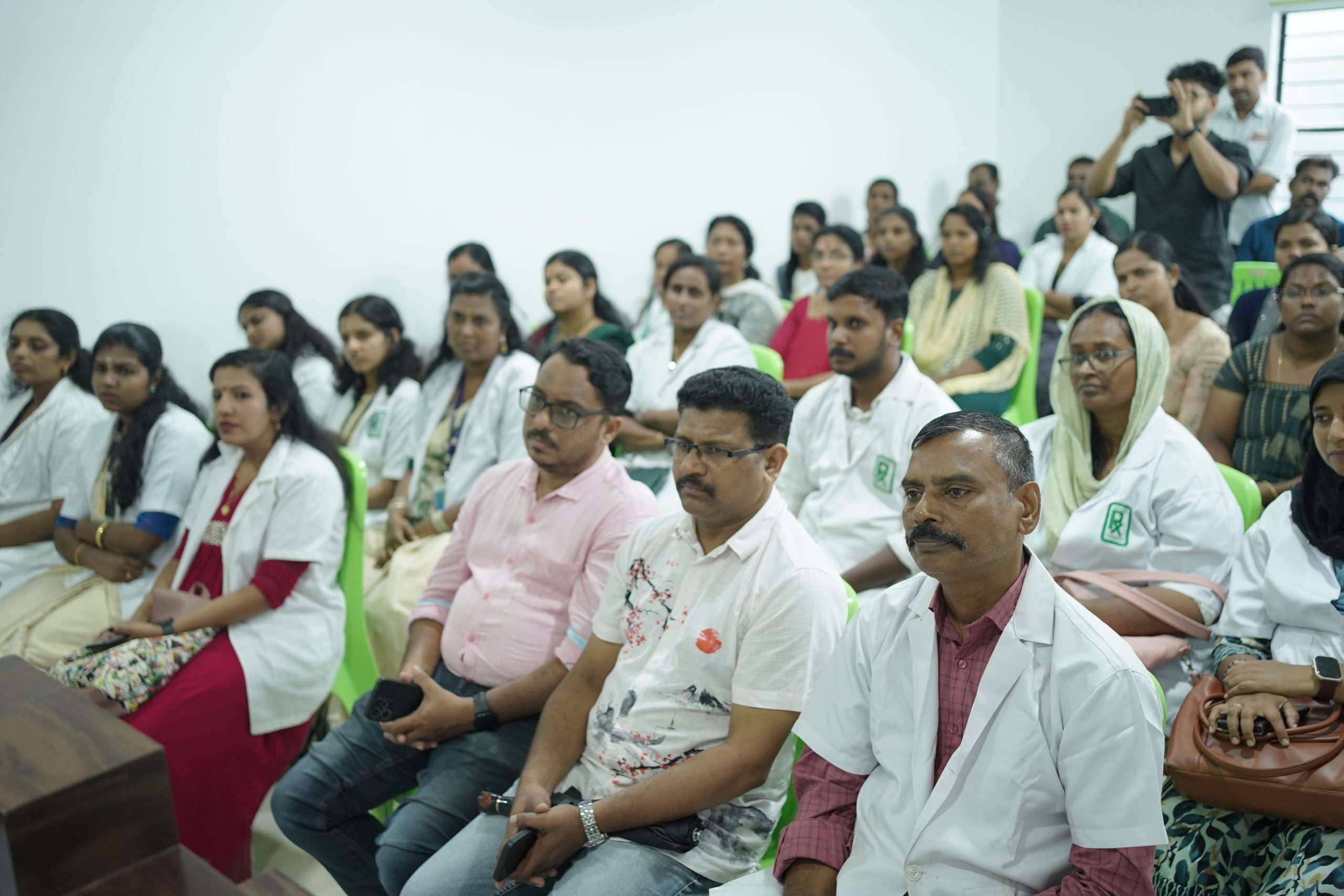 Healthcare professionals and pharmacists attending a pharmacy training session in South India